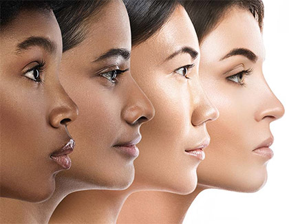 Faces of four woman from different ethnic backgrounds shown in a profile view.